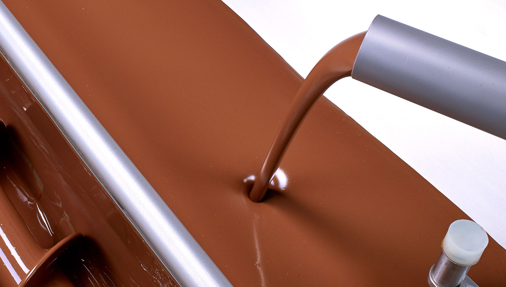 Processing of fluid chocolate.